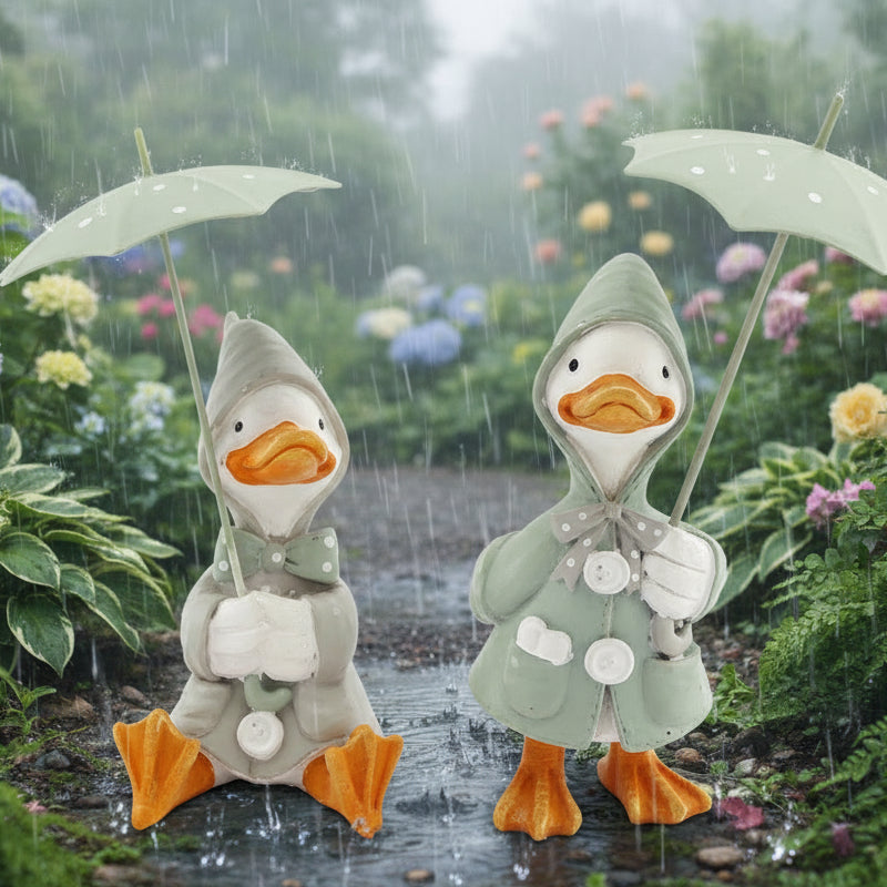 Pair of Ducks in Raincoats with Umbrellas